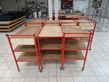 four shelves with drawers on them in the middle of a room