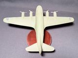 a model of a plane sitting on top of a coin