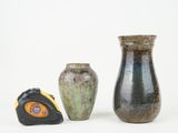 three vases that are sitting next to each other