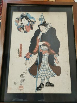 a picture of a framed picture of a man with a cane