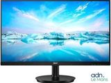 a computer monitor sitting on top of a desk next to an iceberg