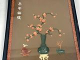 a picture of a picture of a vase with flowers in it