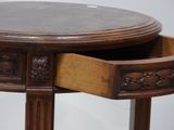 a wooden table with a drawer on top of it