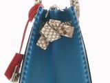 the small blue bag has a bow on the handle