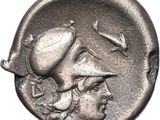 a close up of a silver coin with a man on it