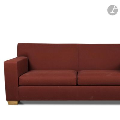 an image of a red couch sitting on top of a white floor