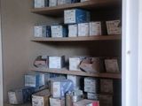 many boxes and boxes on the shelves in the closet