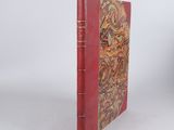 a red book with a gold design on it