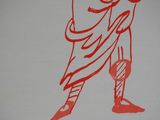 a red drawing of a man holding a baseball bat