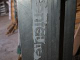 a close up of a piece of metal with a sticker on it