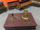 a toy train on the table with other toy trains on the table