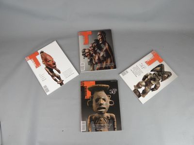 four books on a table with a white table cloth and a white table cloth