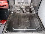 a silver oven with a metal door and a black stove top