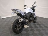 a white and black motorcycle parked in a room