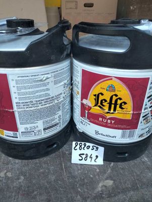 two kegs that are sitting next to each other on a table