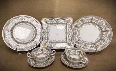 a group of plates and cups and saucers on a table