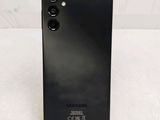 the back of a black phone with a camera attached to it