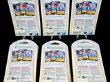 four packs of pokemon trading cards are on a black background