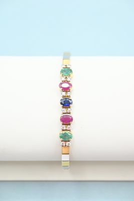 a close up of a bracelet with multi colored stones on it
