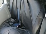 a black seat cover in the back of a car