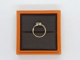 a ring in a box with a diamond on it
