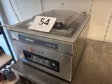 une photo d'une machine sur laquelle est apposée une étiquette de prix