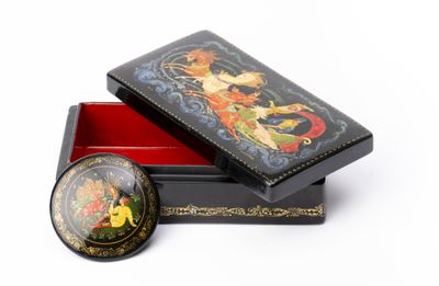 a black box with a picture on it and a red box with a picture on it
