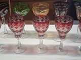 several wine glasses are lined up on a table in a room