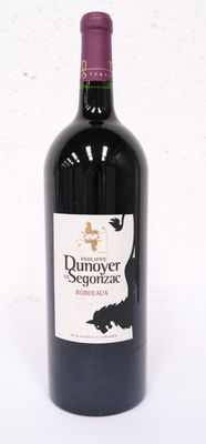 a bottle of wine that is sitting on a table