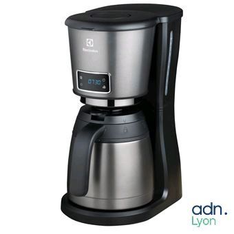 the coffee maker is on a white background with the adn logo on it