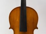 an old violin sitting on a white surface with a white background