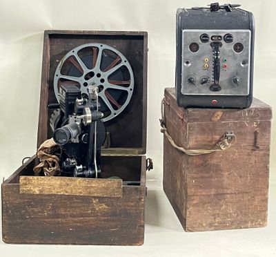 two wooden boxes that have a projector and a projector on them