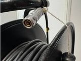 an image of a black hose with a cord attached to it