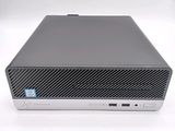 the front view of a desktop computer on a white surface