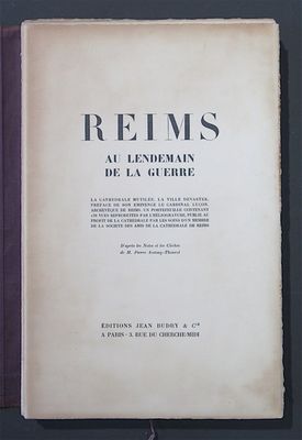 an old book with a black and white cover on a table
