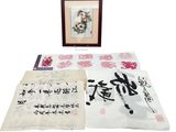 two chinese calligraphys and a framed picture of flowers and birds