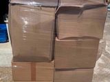 a large stack of boxes sitting on a pallet