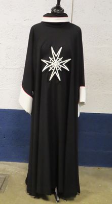 a black and white robe with a snowflake design on it