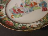 a plate with a picture of a group of people on it