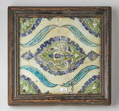 tableau représentant un motif floral bleu et vert, dans un cadre en bois