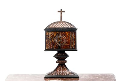 a small table with a cross on top of it