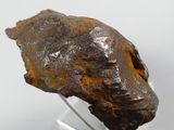 an image of a piece of rock on a clear stand