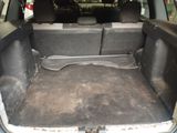 a trunk of a car with the back seats folded down