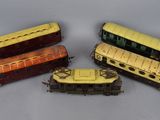 four different types of toy trains are shown on a white surface