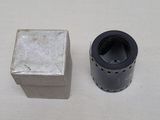 a silver object next to a black object on a white surface