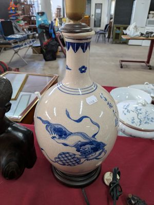 a large vase with a blue and white design on it
