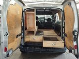 a van that has some drawers in the back of it