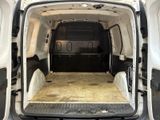 a white van with the door open in a parking lot