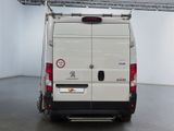 a white van that is parked in a room