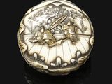a silver box with a picture of a man and a woman in a boat